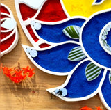 Close-up of mirror work on peacock reusable rangoli mat