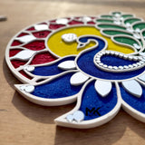 Peacock rangoli mat placed at home entrance for Diwali